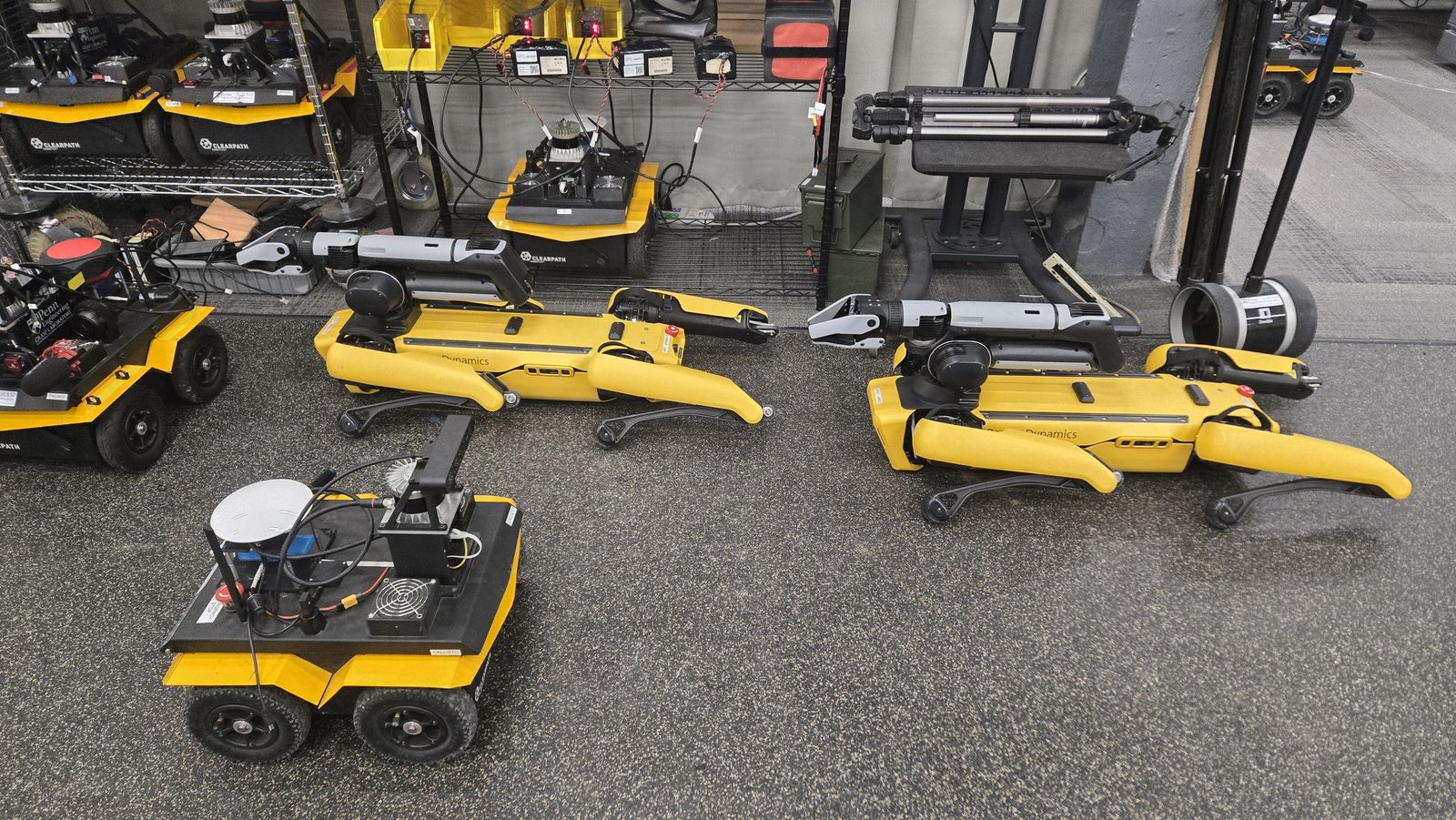 The heterogeneous fleet the challenge is run with — Boston Dynamics Spots alongside Clearpath Jackals. My work is the ground autonomy on the Jackal.
